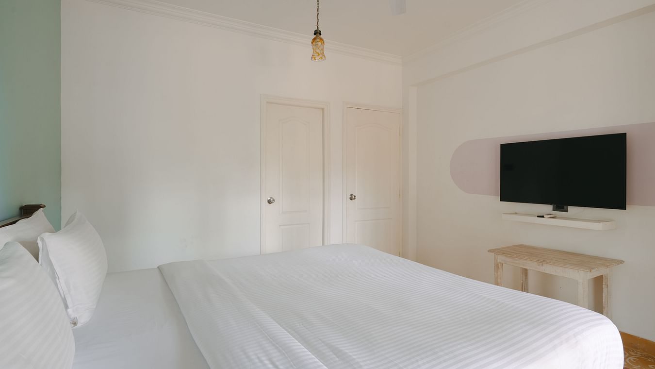 Bright and airy bedroom with contemporary furnishings at One BHK Apartment, Richmonde Ananta Elite, Goa.