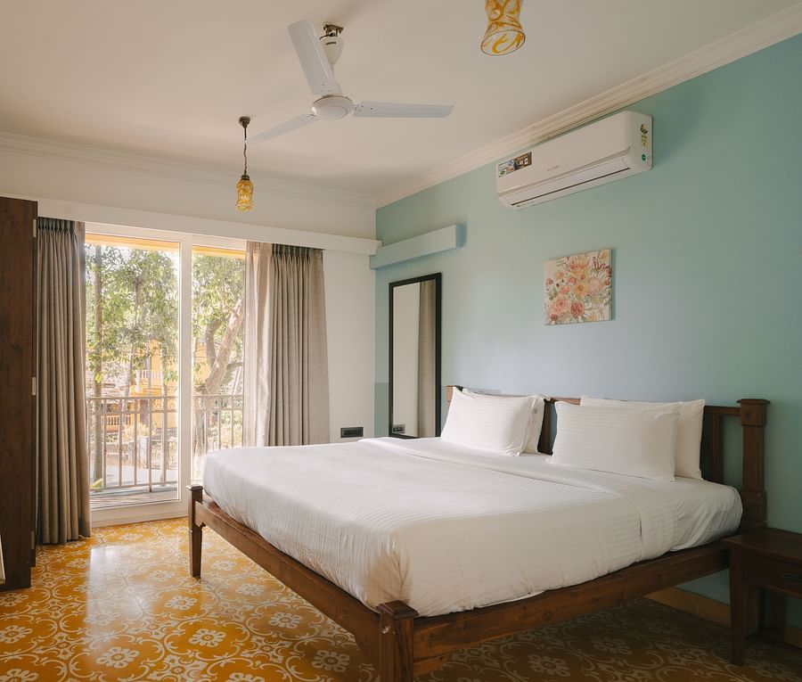 Chic bedroom with a TV and serene ambiance at One BHK Apartment, Richmonde Ananta Elite, Goa.