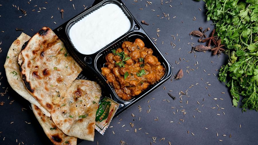 A picture of chole Kulcha served with curd | Diamond Parks, Pune