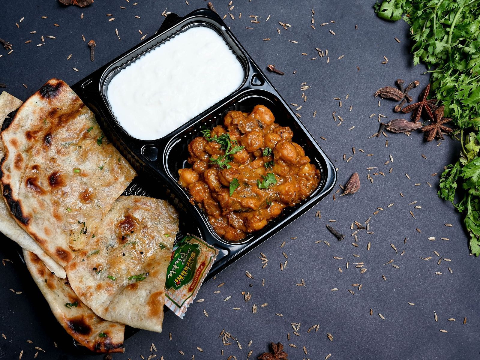 A picture of chole Kulcha served with curd | Diamond Parks, Pune