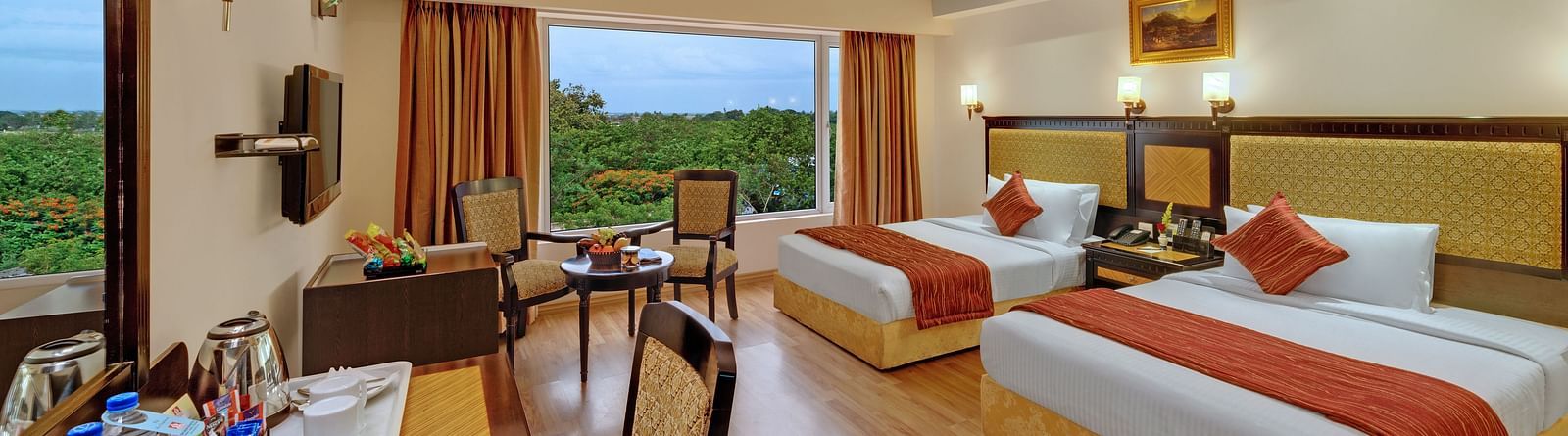 Room with two large beds at SRM Hotel Trichy