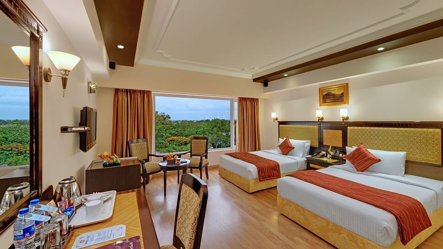Room with two large beds at SRM Hotel Trichy