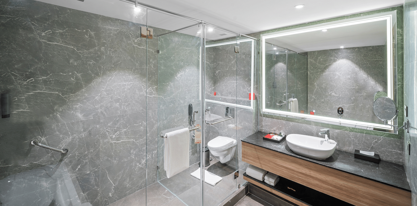 An image of a suite bathroom in Vijaywada - Grand Vijaywada by GRT Hotels