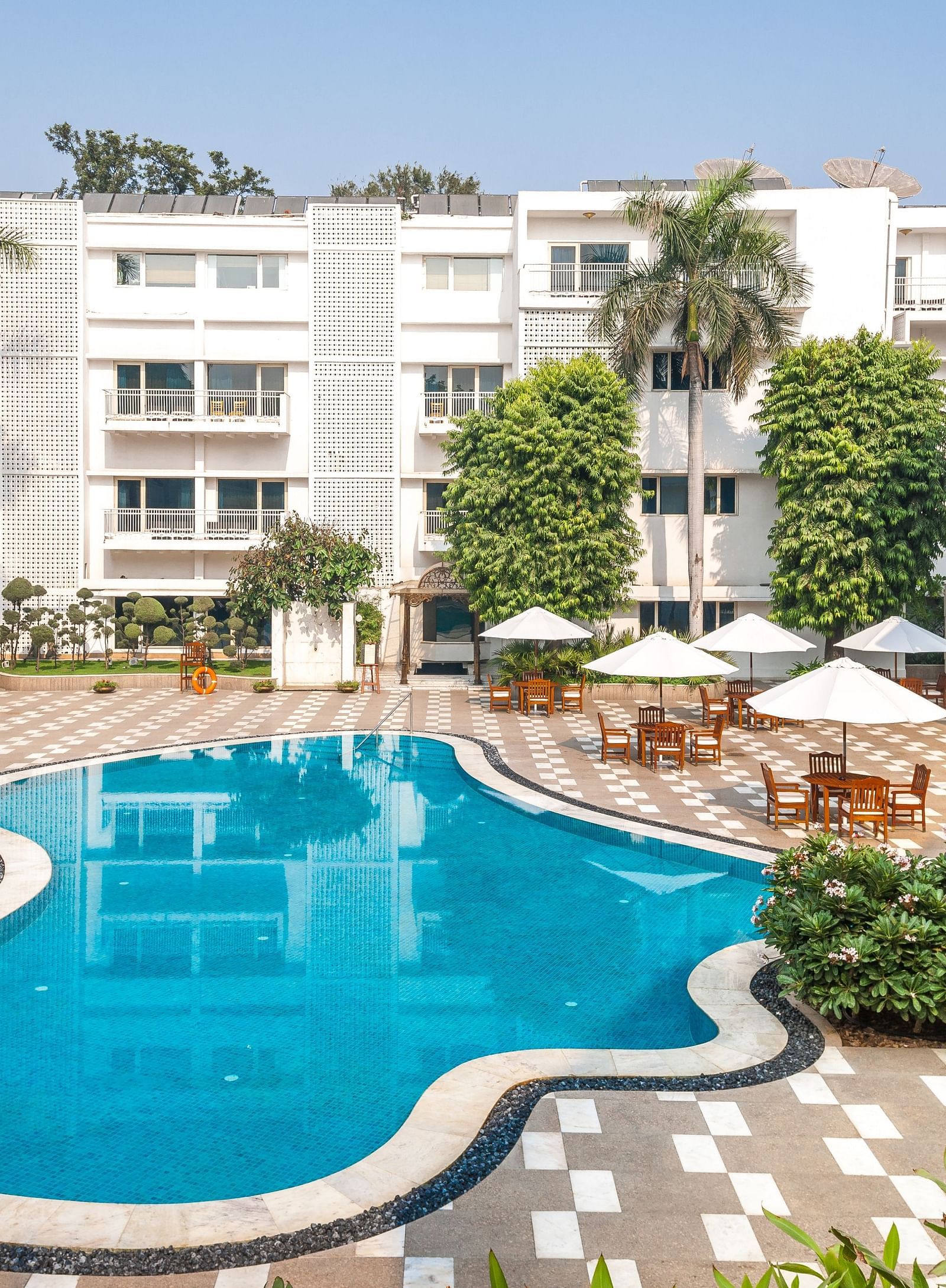 a drone shot of the swimming pool area at The Claridges New Delhi