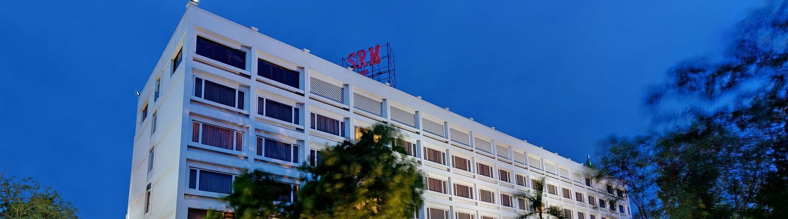 Night view of SRM Hotel Tiruchirappalli facade