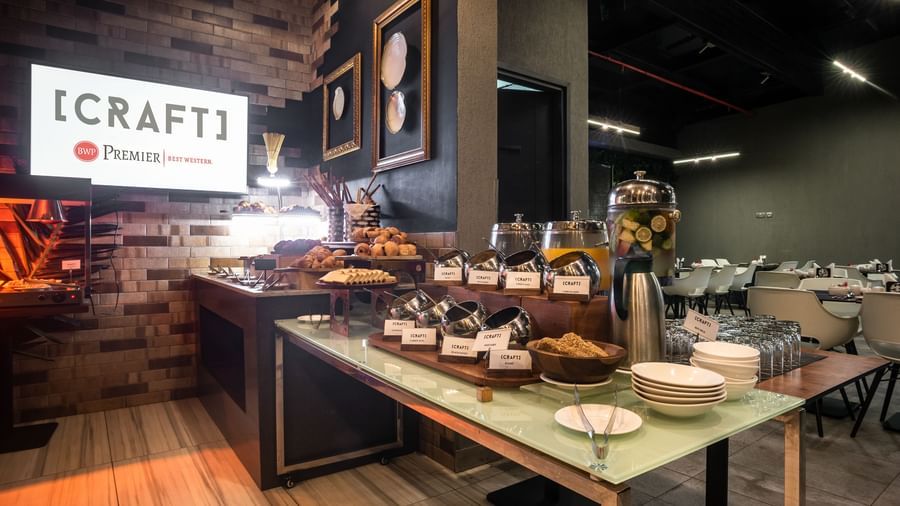 Buffet spread at Craft restaurant in Best Western Premier Westlands hotel, showcasing a variety of sweet and savory options with a [CRAFT] sign in the background.