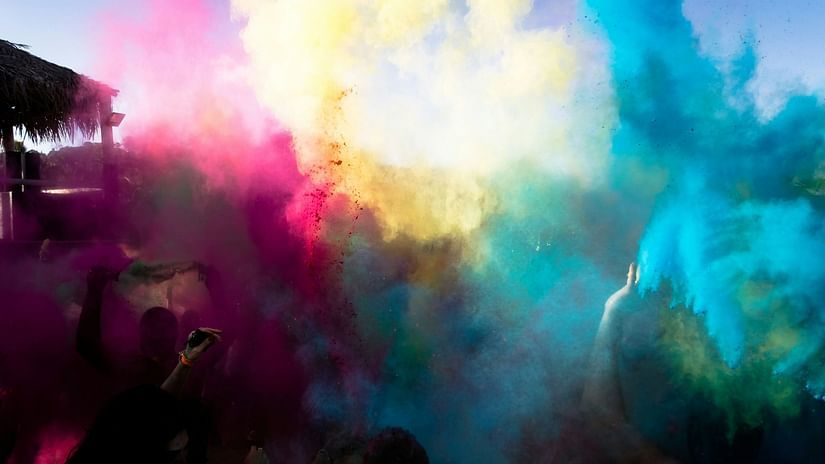 Vivid Holi colours explode in a vibrant cloud, celebrating the joyful festival of spring. 