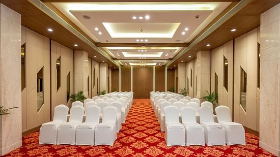 Round table seating arrangements inside the Banquet hall - The Orchid Hotel, Jamnagar