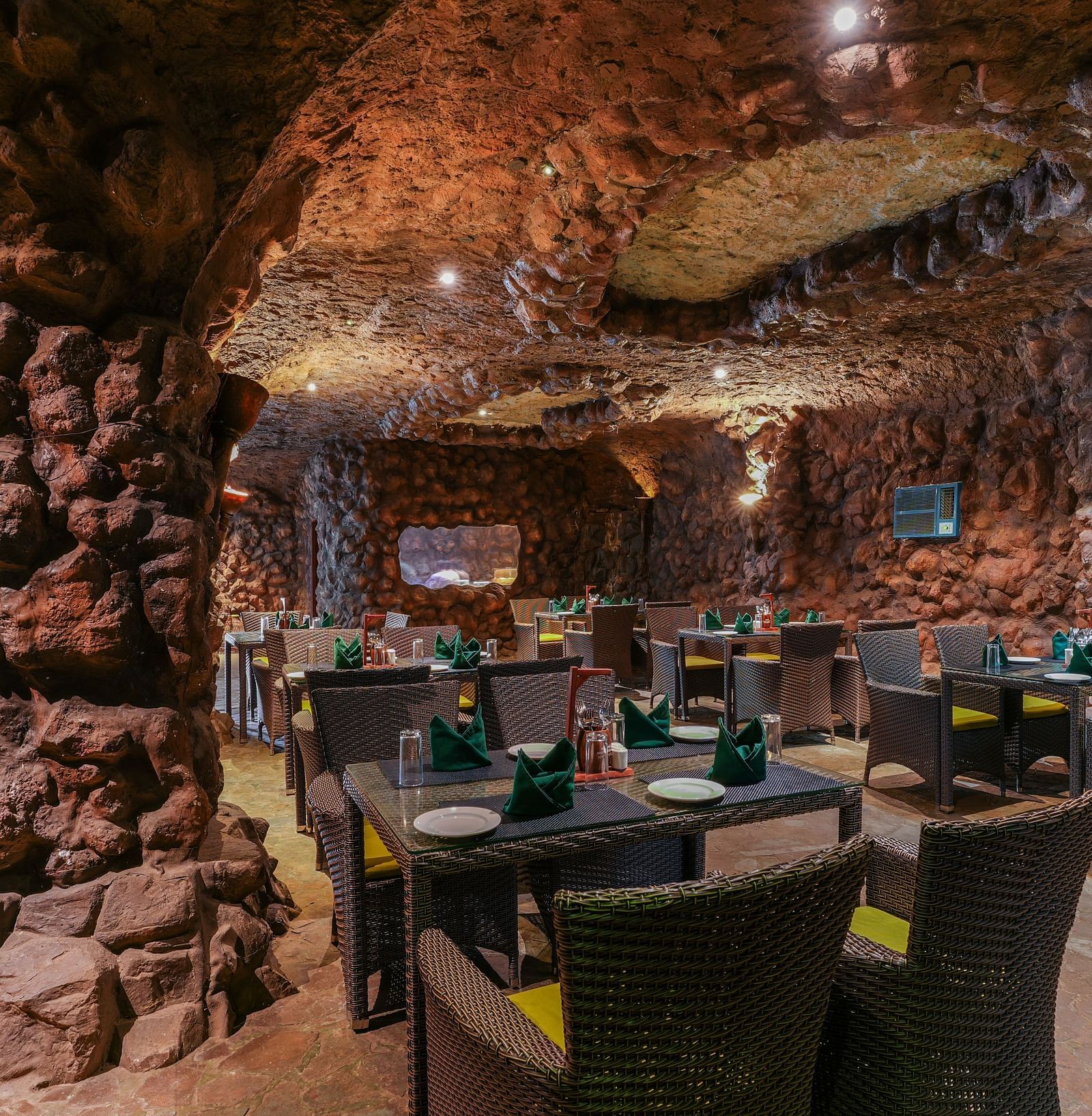 Kholong restaurant with a rock-themed décor, warm lighting, all tables, seating, and culinary arrangements arranged aesthetically1