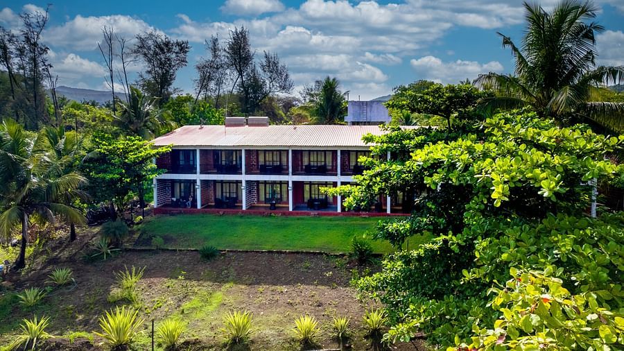 Exterior facade of Lotus eco beach murud beach dapoli with lush greenery around the property