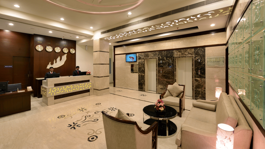 A well-lit reception area with seating adjacent to it