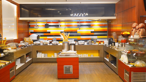 Buffet counter at Nemesia restaurant featuring a variety of desserts.
