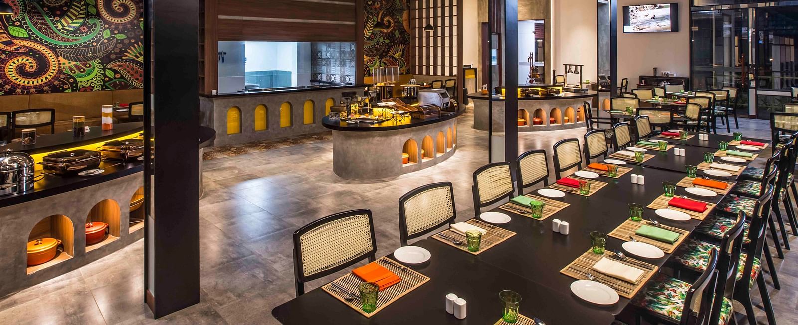 Image of the restaurant with a buffet setting.| Great Trails Wayanad by  GRT hotels. 