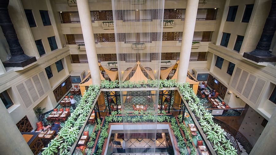 top view of the fountain in the lobby at the orchid hotel mumbai with dining area near it
