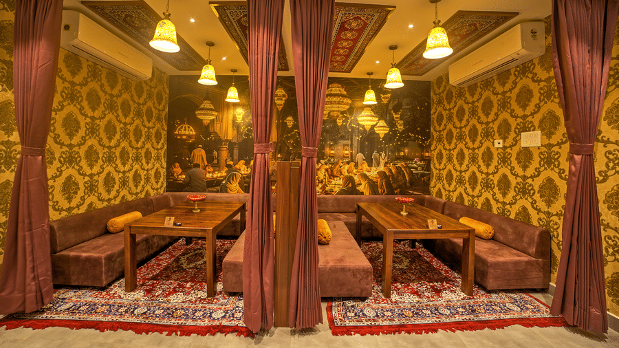 Comfortable semi-private dining space with cushioned benches at Ilara Hotels & Spa, OMR, Chennai