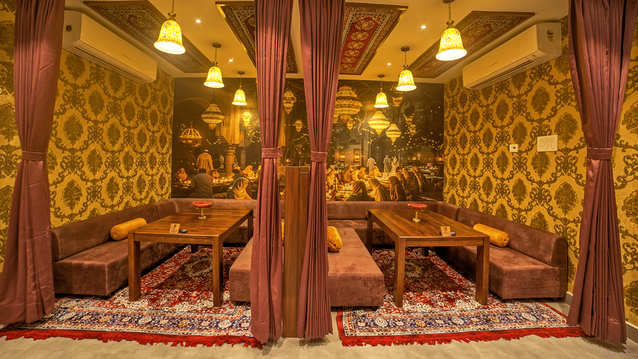 Comfortable semi-private dining space with cushioned benches at Ilara Hotels & Spa, OMR, Chennai