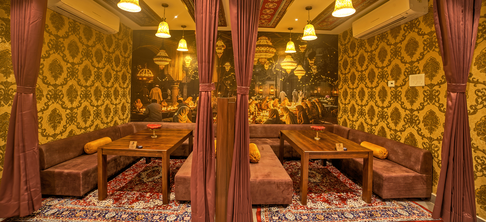Comfortable semi-private dining space with cushioned benches at Ilara Hotels & Spa, OMR, Chennai
