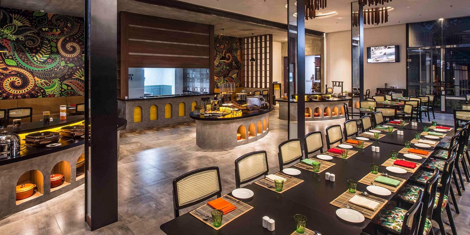 Image of the restaurant with a buffet setting.| Great Trails Wayanad by  GRT hotels. 