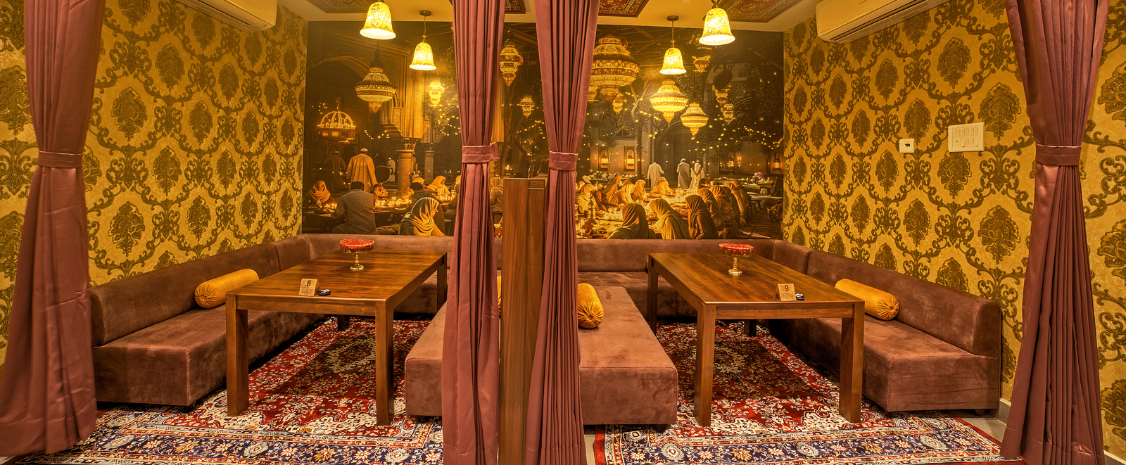 Comfortable semi-private dining space with cushioned benches at Ilara Hotels & Spa, OMR, Chennai