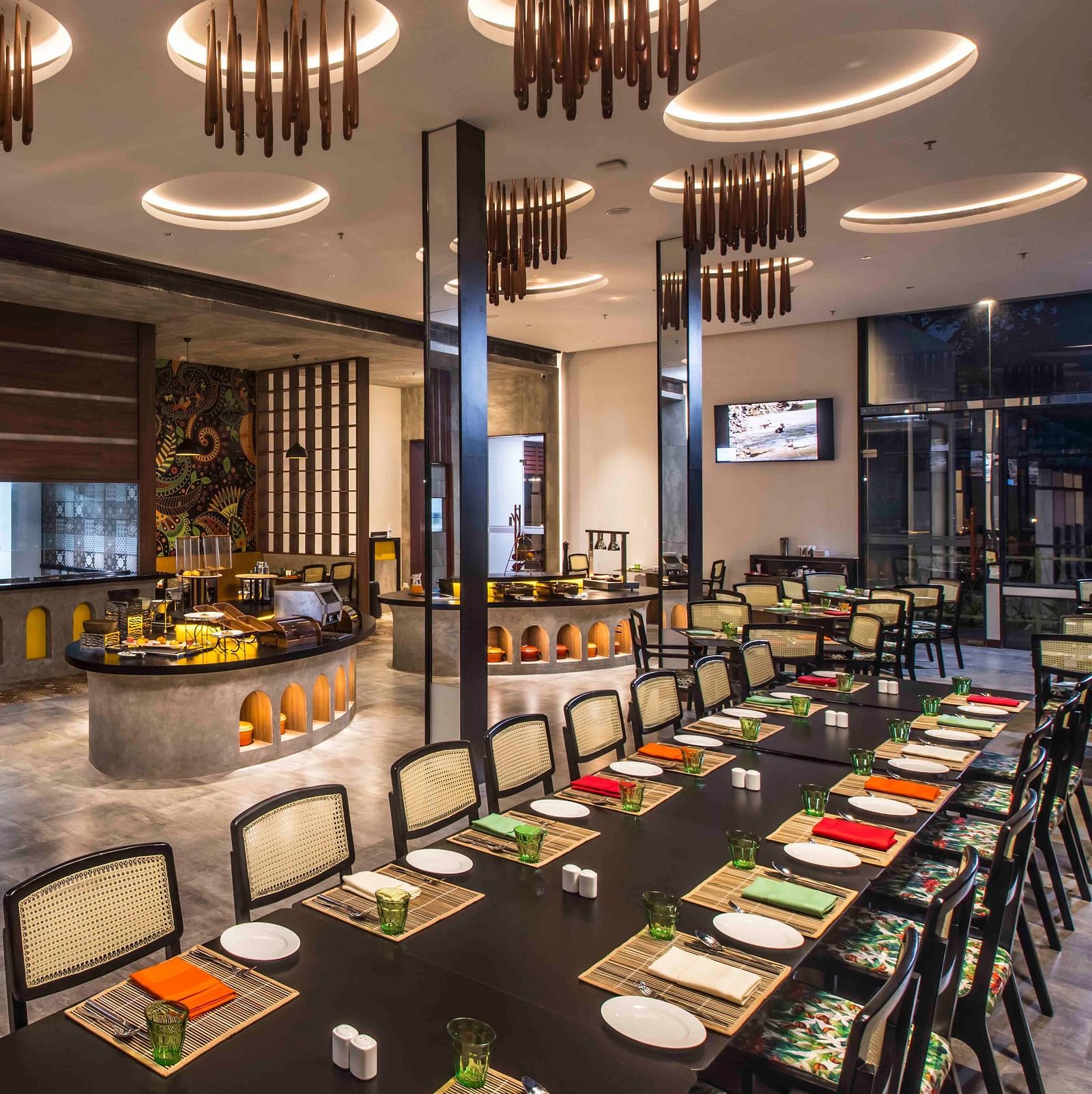 Image of the restaurant with a buffet setting.| Great Trails Wayanad by  GRT hotels. 