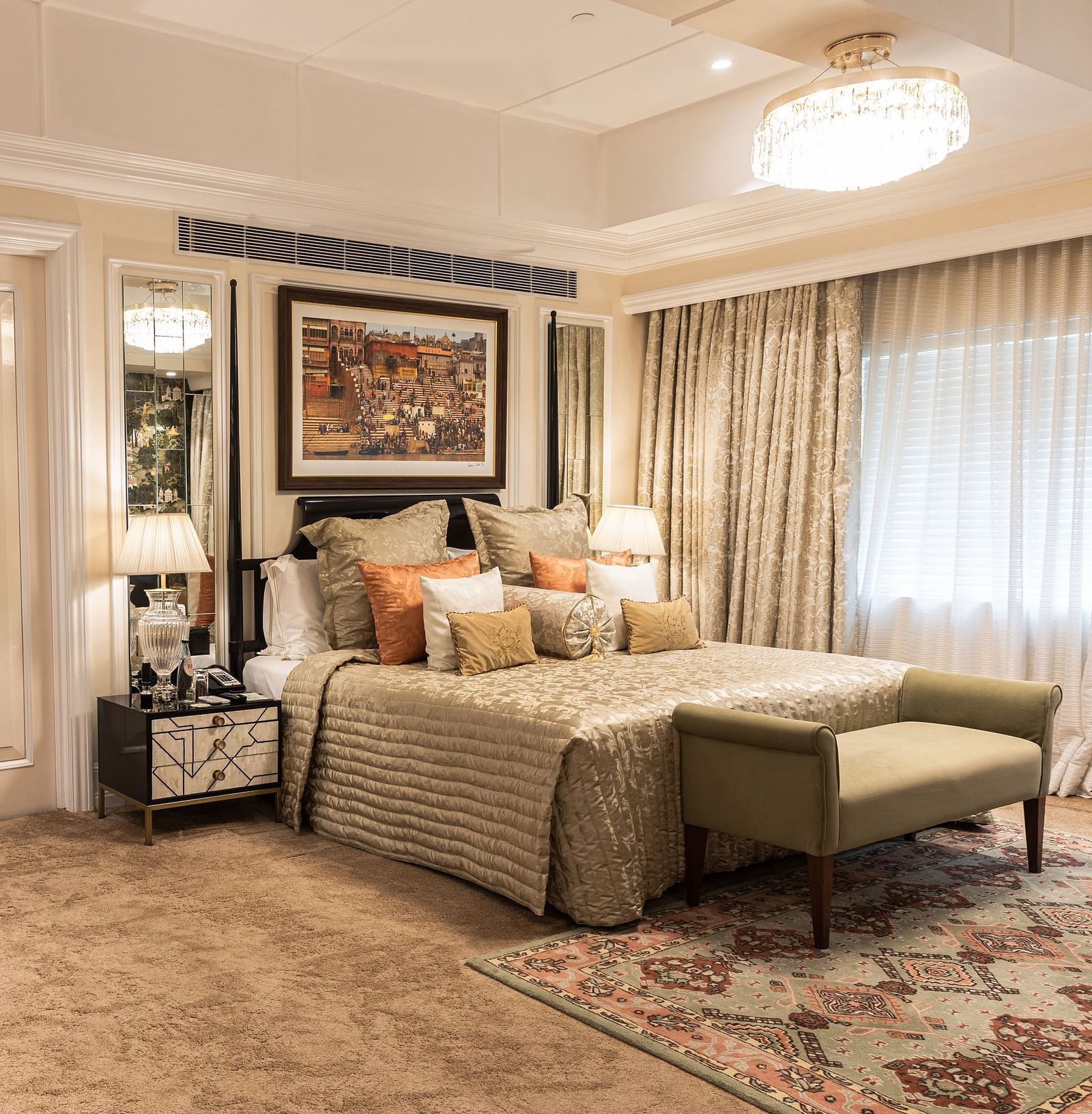 image of the bed and the bureau with a hexagonal mirror above it at our willingdon crescent suite - The Claridges New Delhi