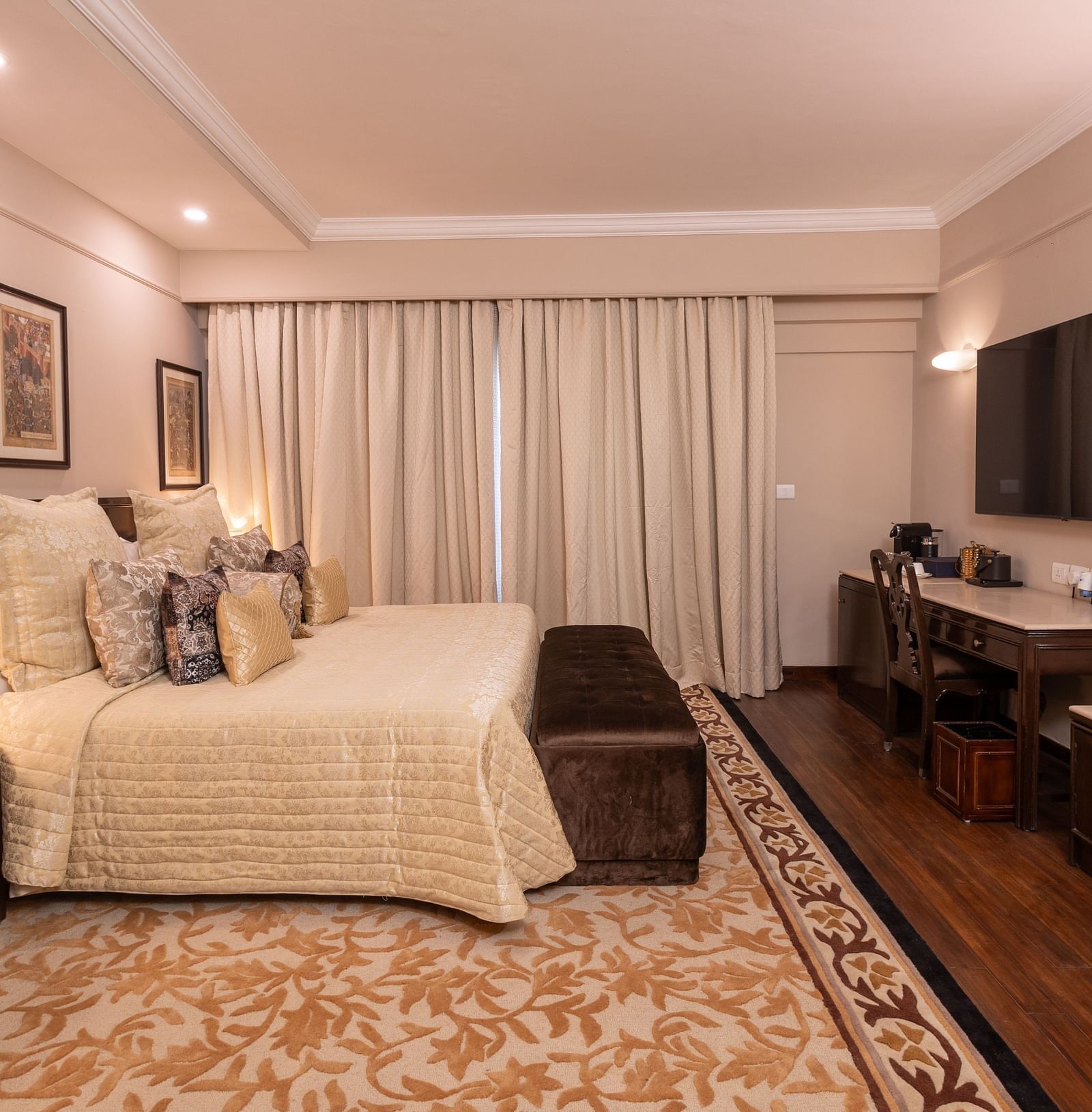 image of a spacious and an elegant bedroom of the heritage terrace room - The Claridges New Delhi