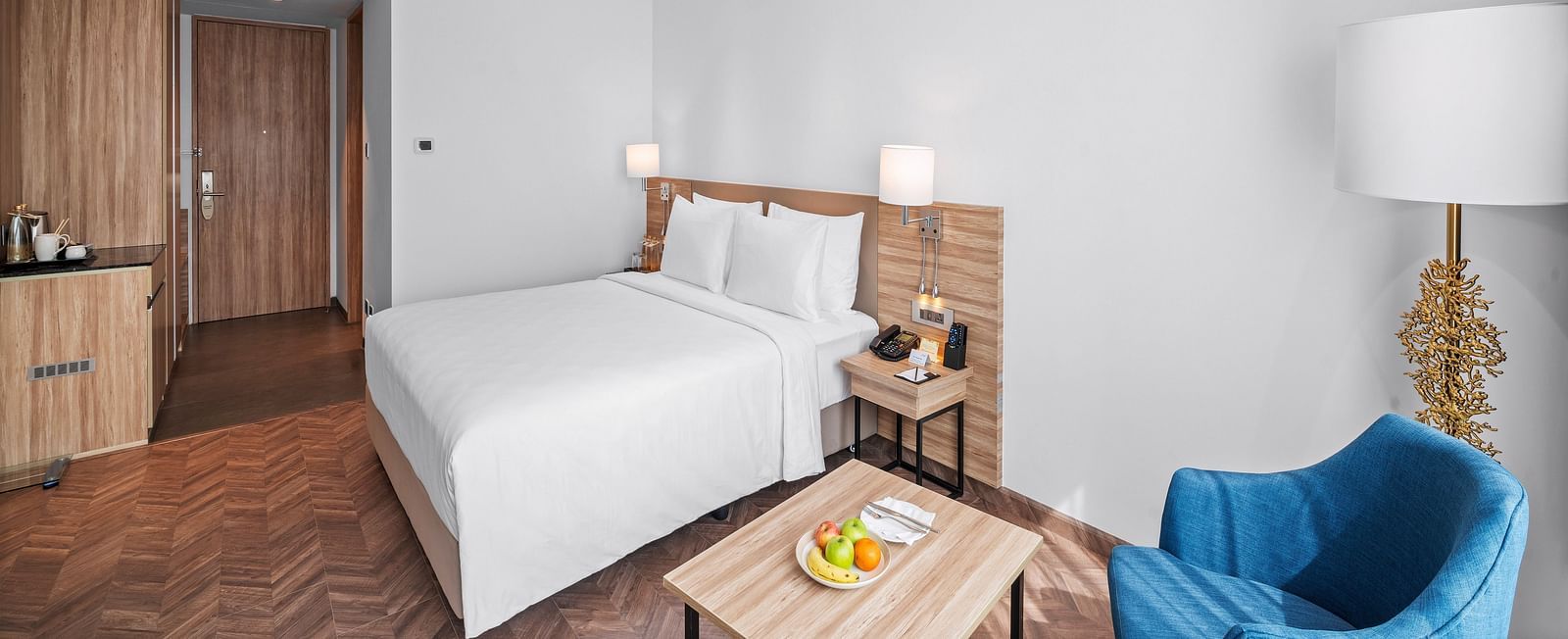 An image of a king size bed of a Grand Club Room at Grand Vijayawada by GRT Hotels.