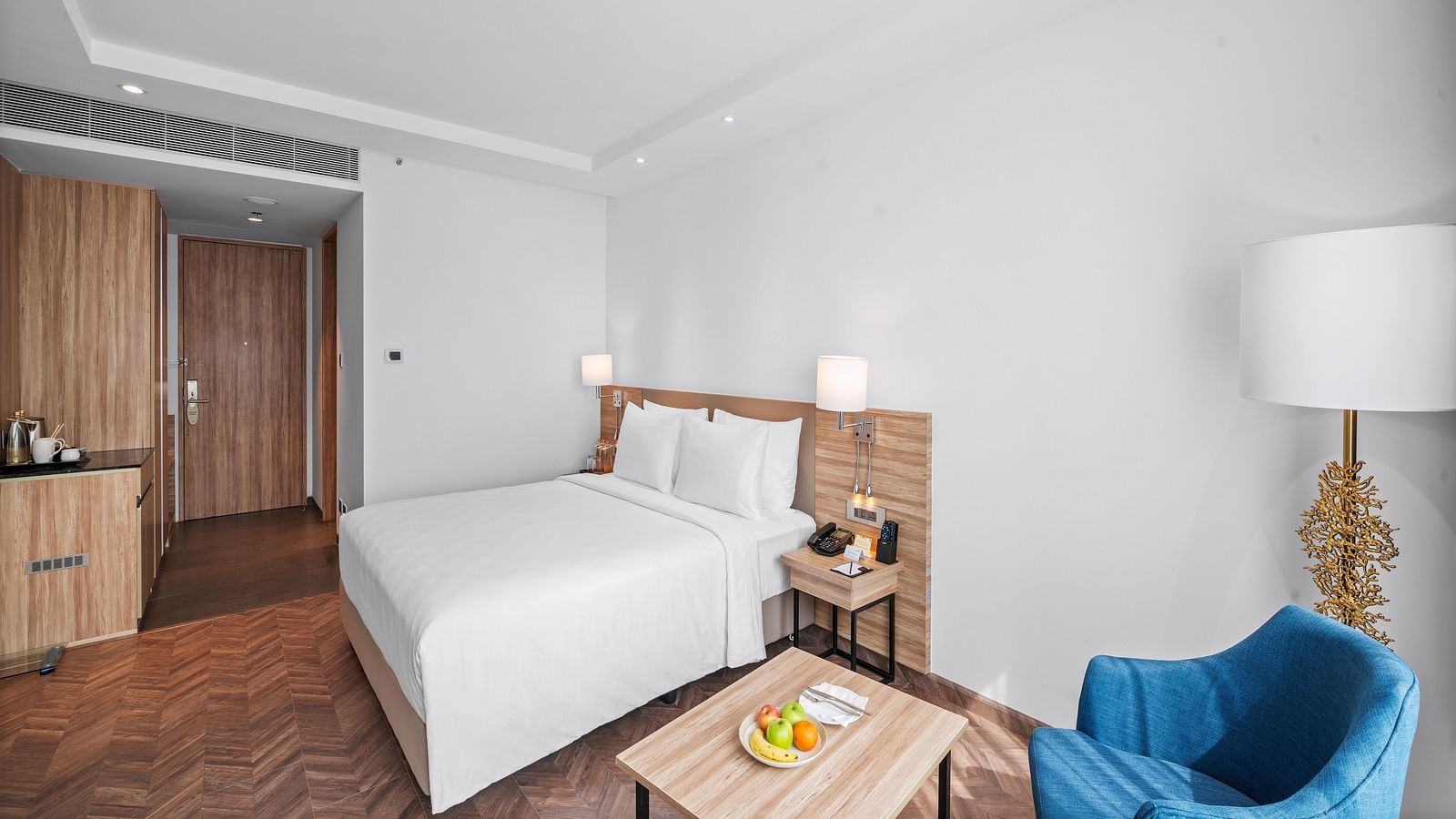 An image of a king size bed of a Grand Club Room at Grand Vijayawada by GRT Hotels.