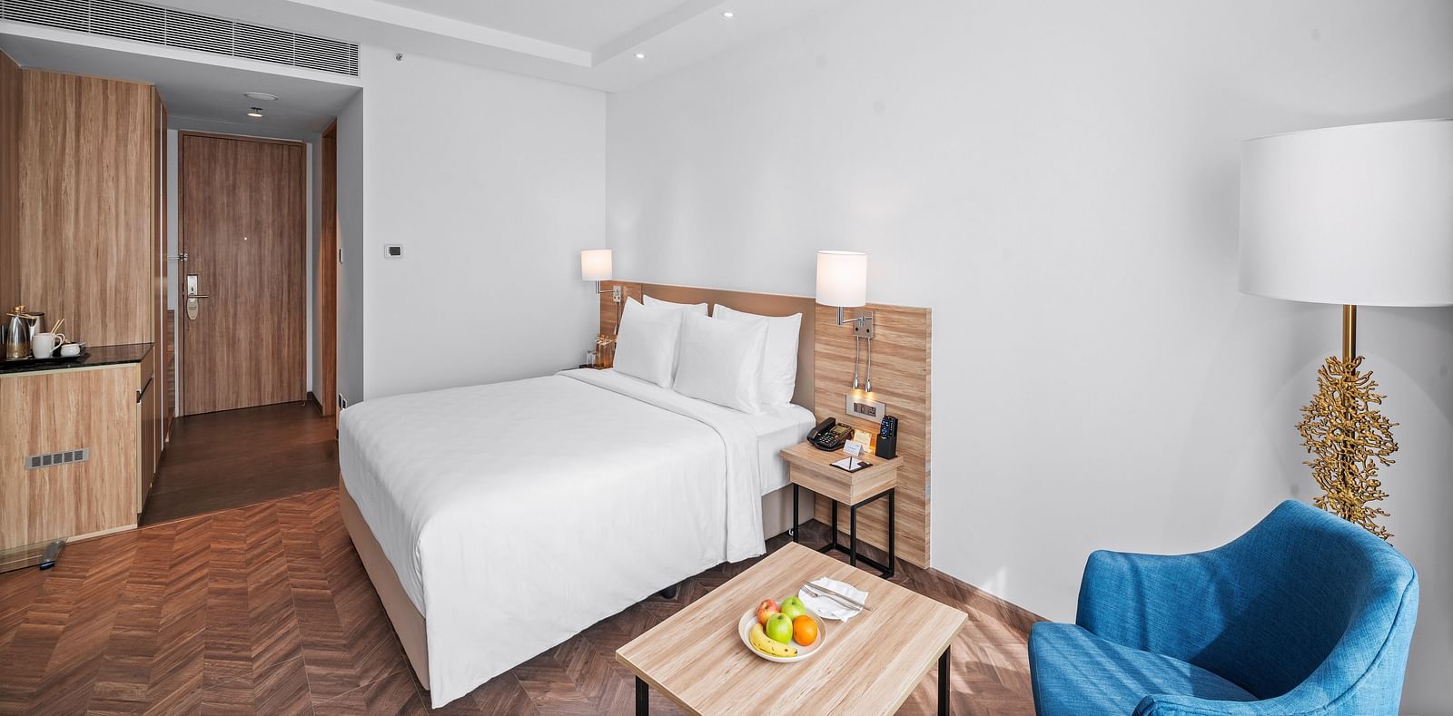 An image of a king size bed of a Grand Club Room at Grand Vijayawada by GRT Hotels.
