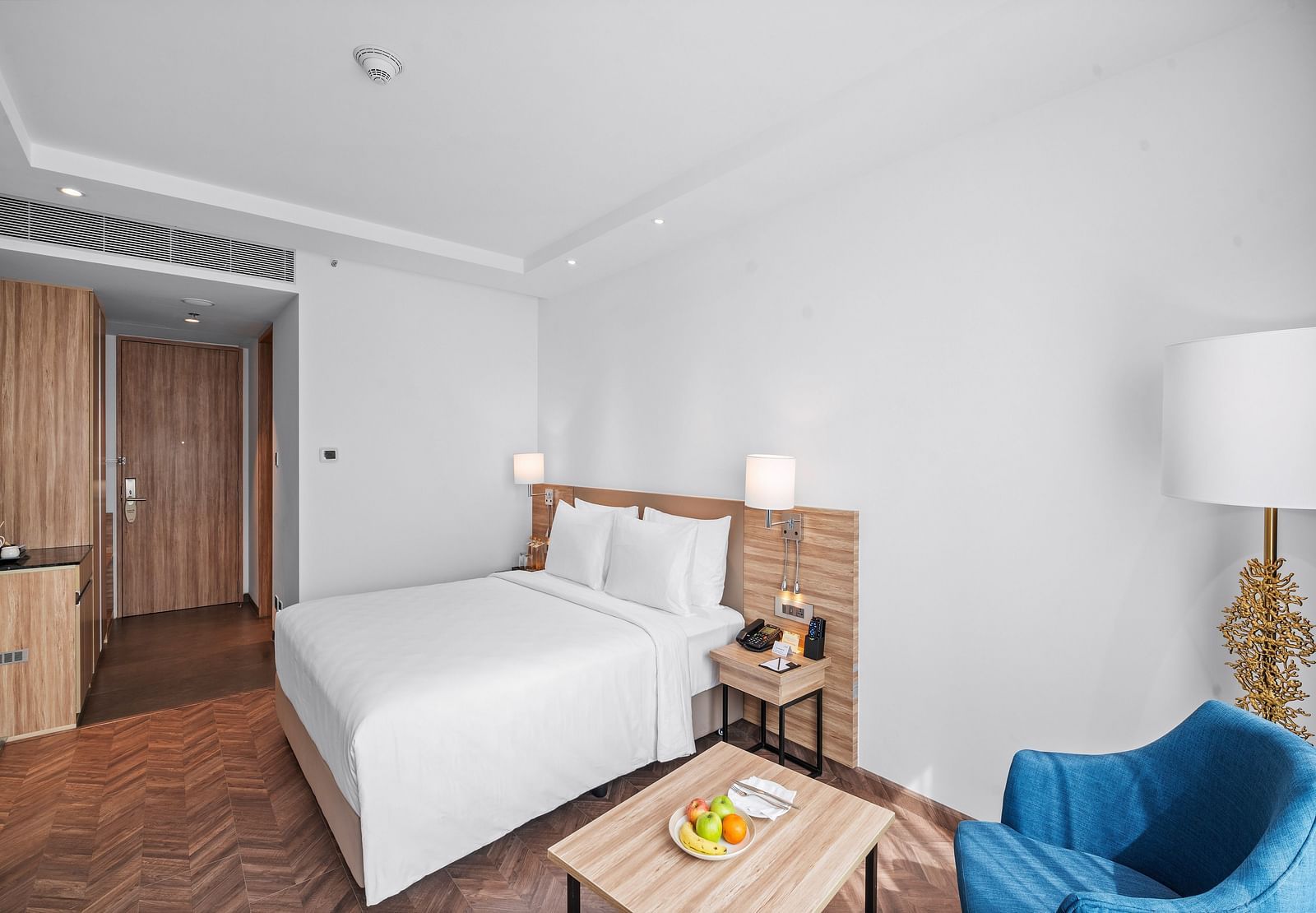 An image of a king size bed of a Grand Club Room at Grand Vijayawada by GRT Hotels.