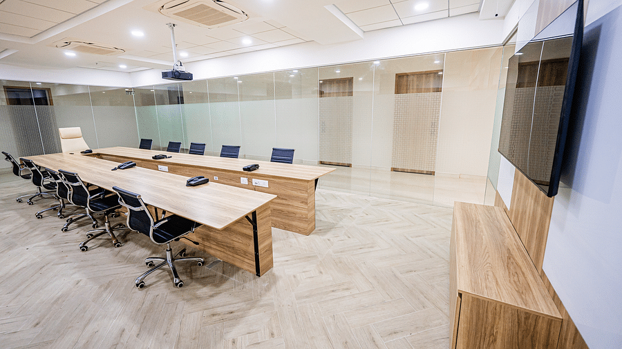 A conference setup with multiple chairs and tables in a professional setting at Lotus Leaf Boutique Hotel.