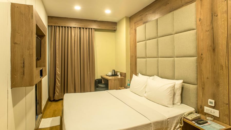 Cosy hotel room with a double bed and a textured headboard | The Citi Residenci Hotel Durgapur