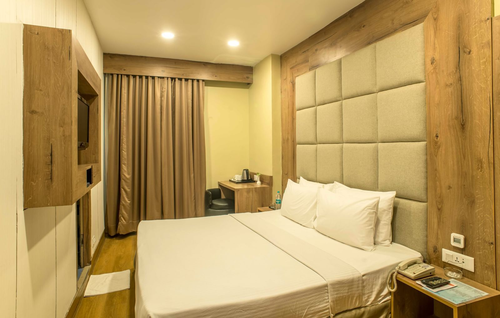 Cosy hotel room with a double bed and a textured headboard | The Citi Residenci Hotel Durgapur