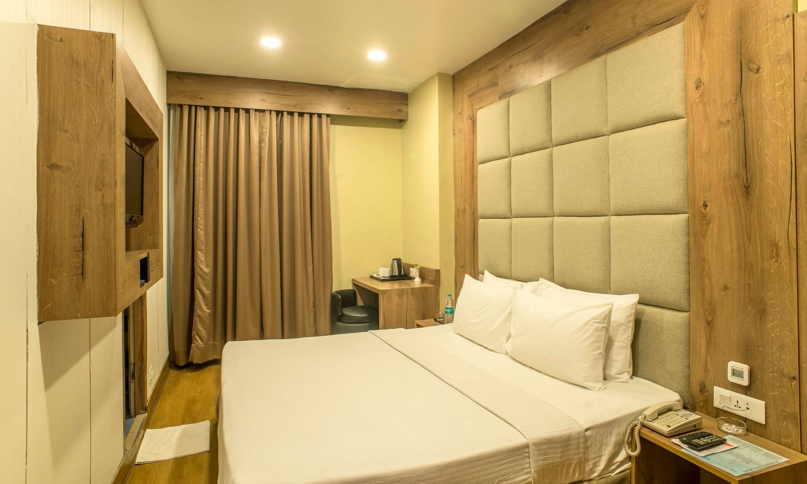 Cosy hotel room with a double bed and a textured headboard | The Citi Residenci Hotel Durgapur