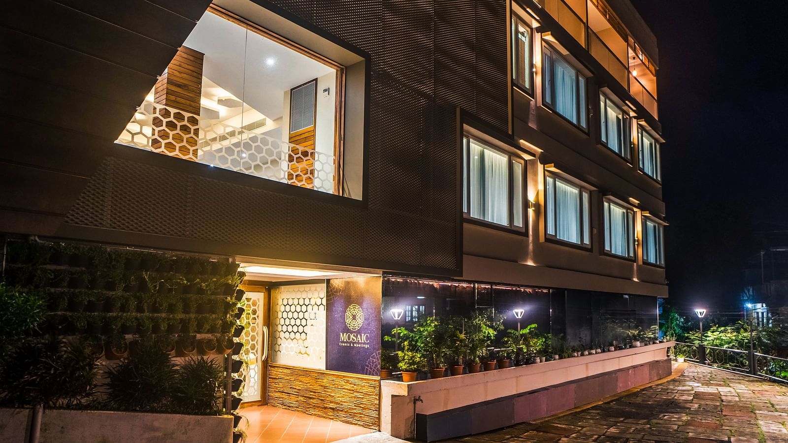 Night view of facade at Coral Reef Hotel & Resort