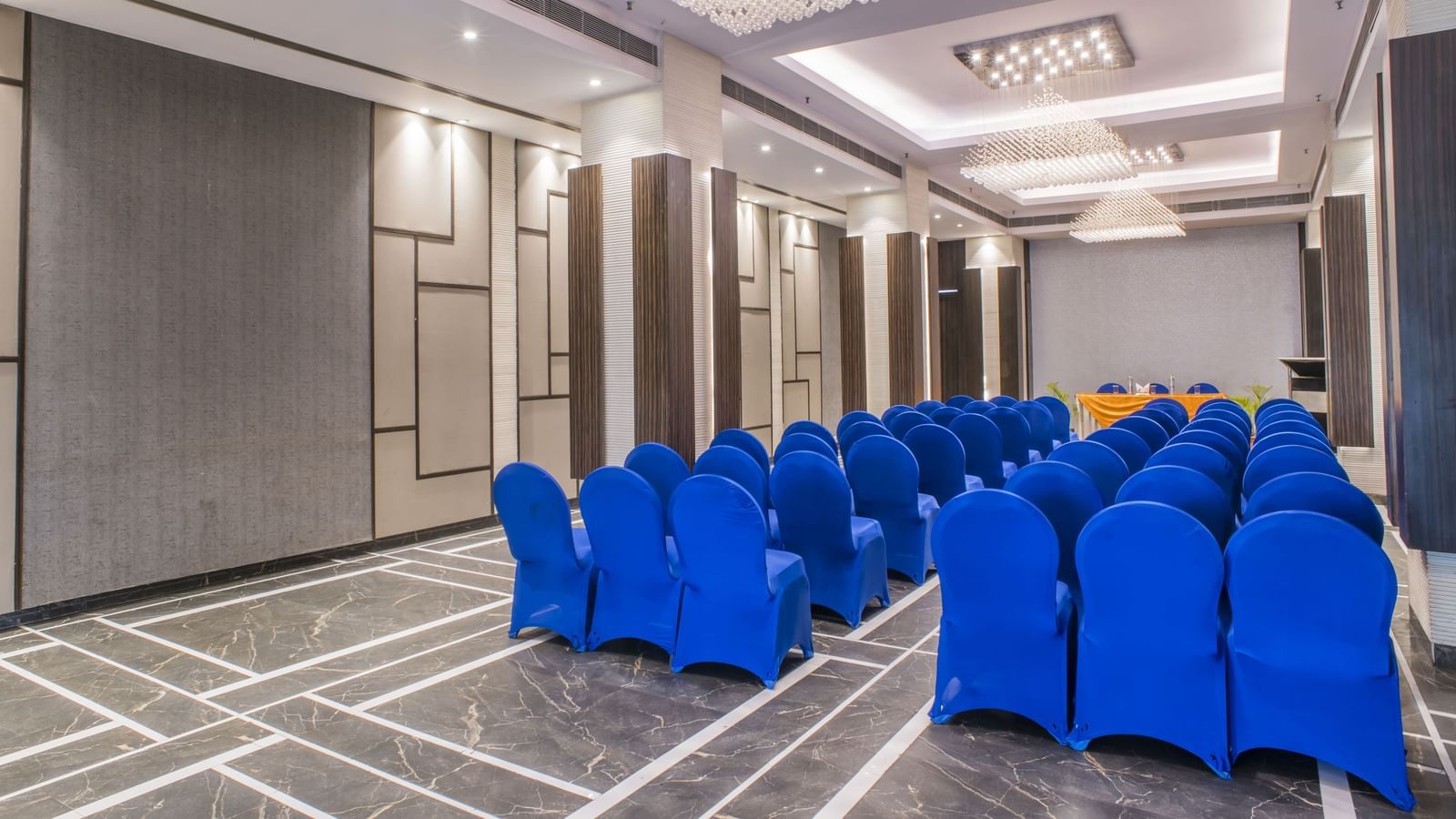 A meeting room with blue chairs at The Citi Residenci Hotel, Asansol.