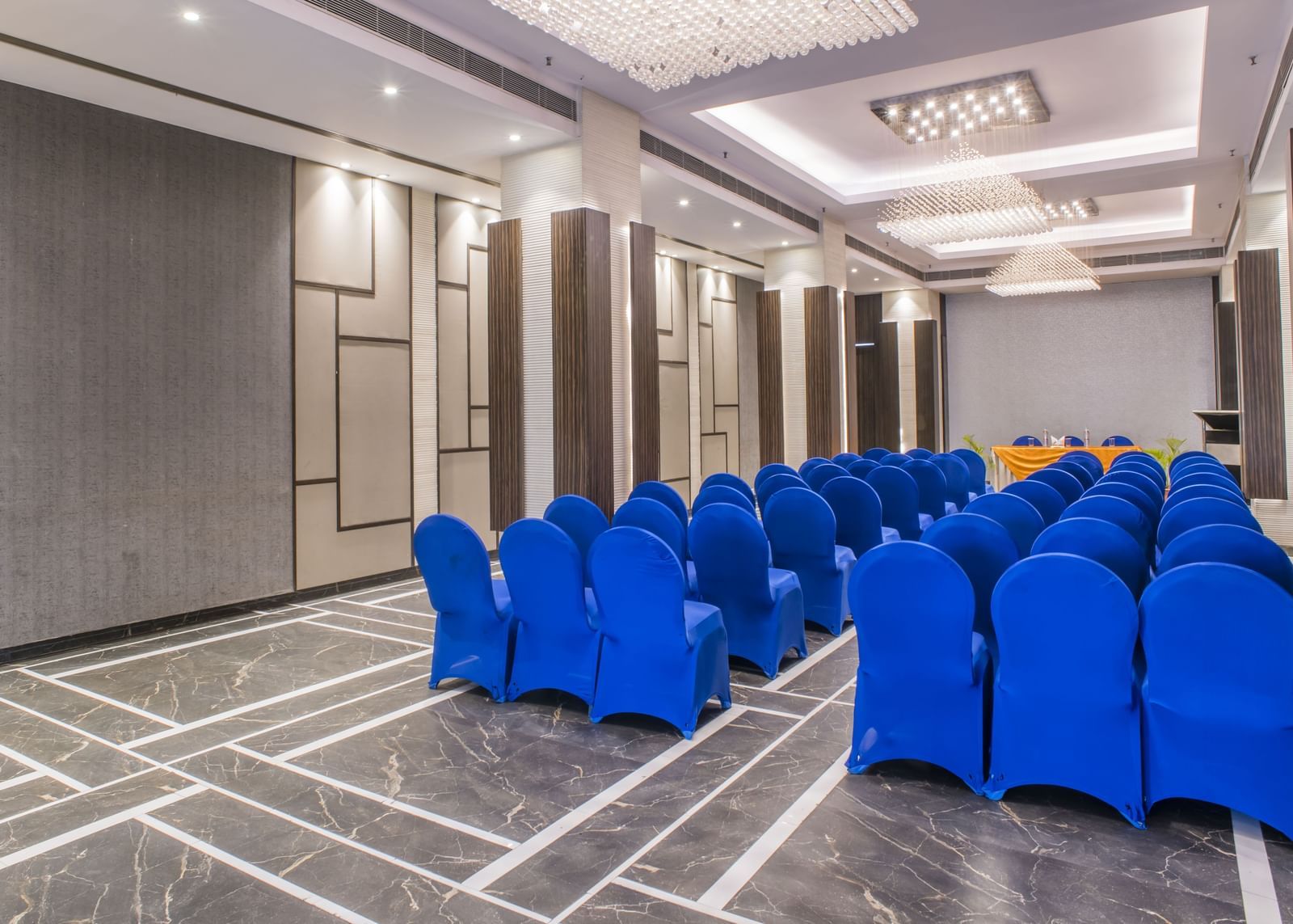 A meeting room with blue chairs at The Citi Residenci Hotel, Asansol.