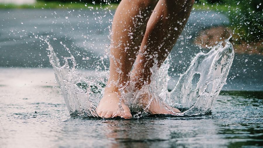 The exhilarating sensation of splashing through a puddle, captured in a moment of pure joy and carefree abandon