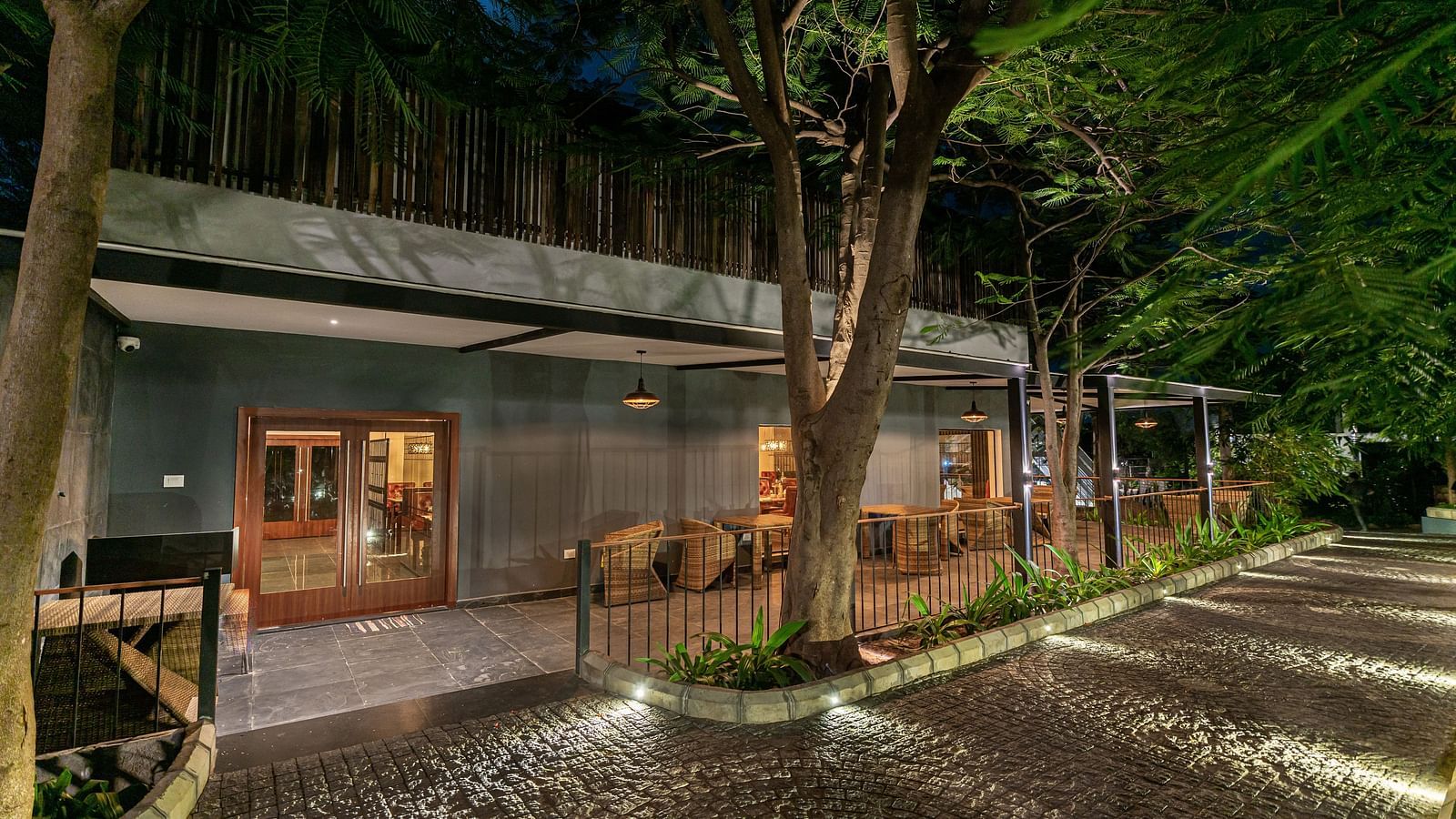 image of the entrance of the mekong restaurant with pathway lights illuminating the pathway - Darza Resorts