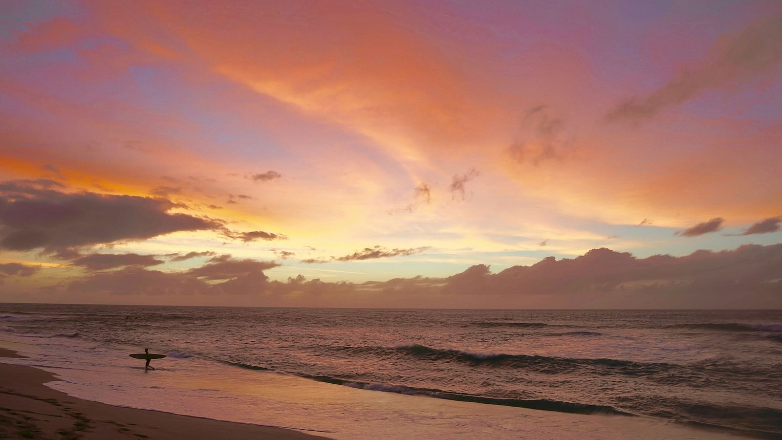 An overview of a beach after the sunset with different hues in the sky