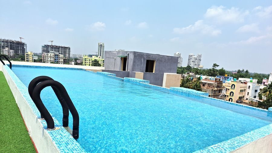 Rooftop infinity pool with urban views at Starlit Suites, Newtown, Kolkata