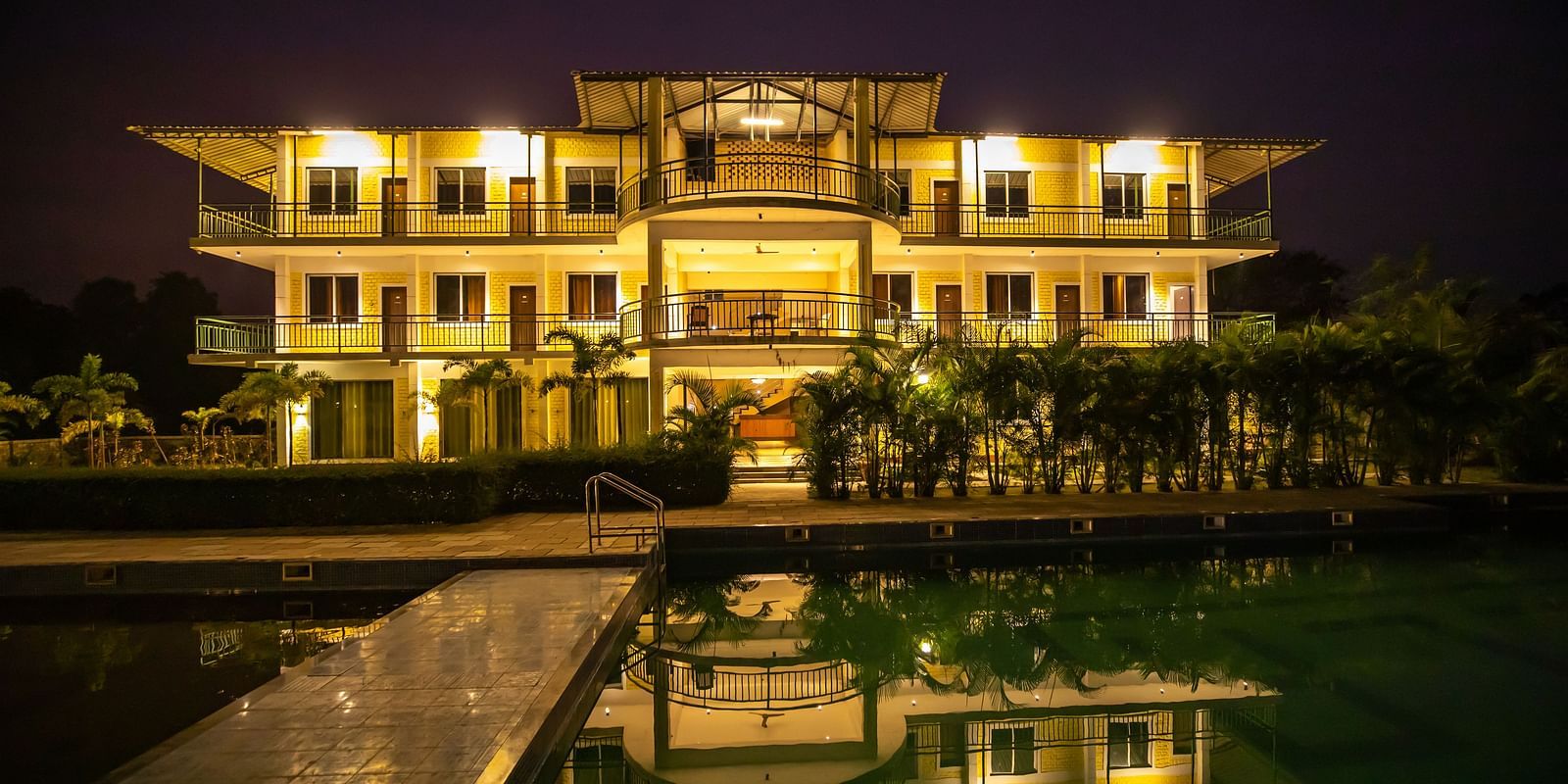 Facade of The Kanila Resort with a swimming pool taken during the night.