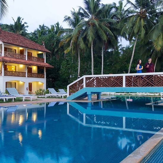 A swimming pool with a bridge going over it