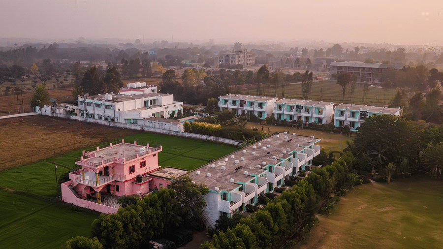 Overview of Vedikant Resorts The Mallard Corbett featuring an closely located buildings surrdounded by lawns and trees.