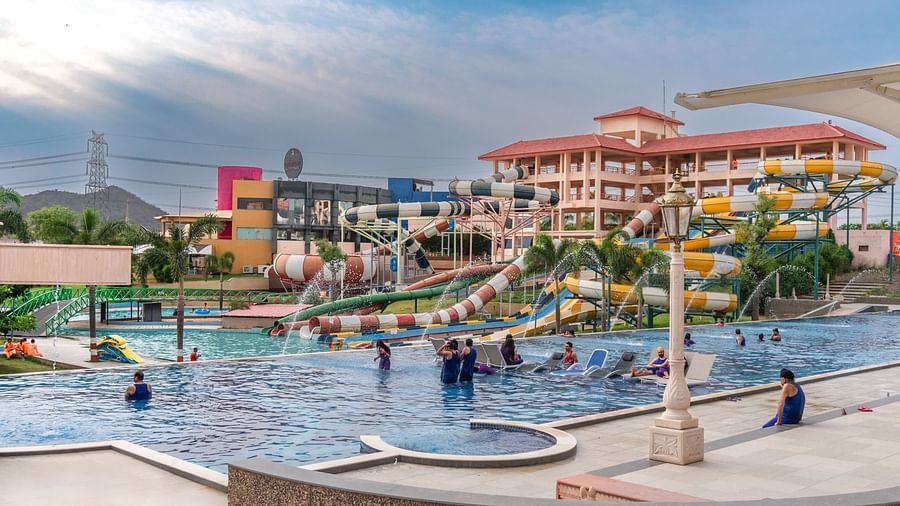 A wide view of the pool and slides at the water park