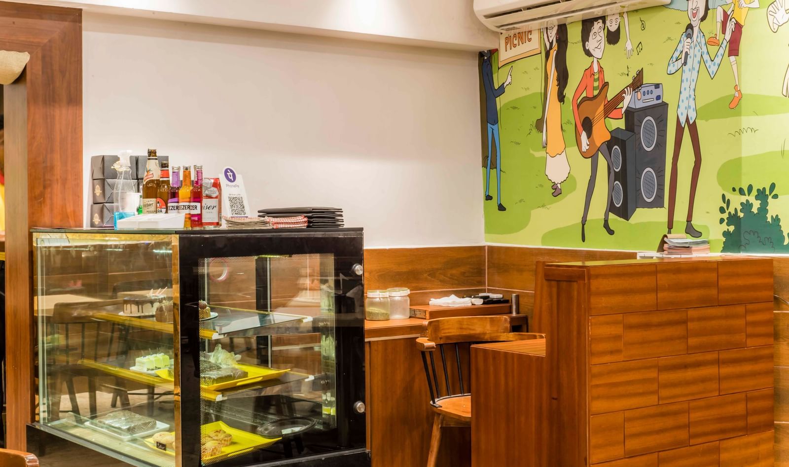 Another view of the food display case and dining area at The Citi Residenci Hotel, Durgapur.