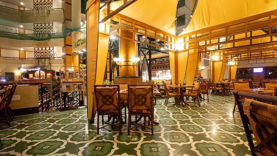 elegant interior of our 24-hour coffee shop in vile parle - The Orchid Hotel Mumbai Vile Parle