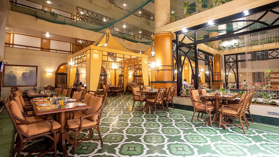 elegant interior of our 24-hour coffee shop in vile parle - The Orchid Hotel Mumbai Vile Parle