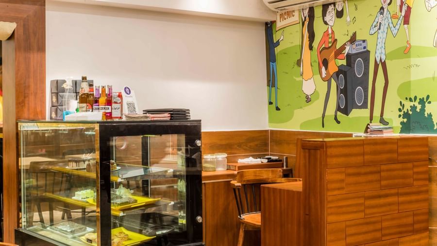 Another view of the food display case and dining area at The Citi Residenci Hotel, Durgapur.