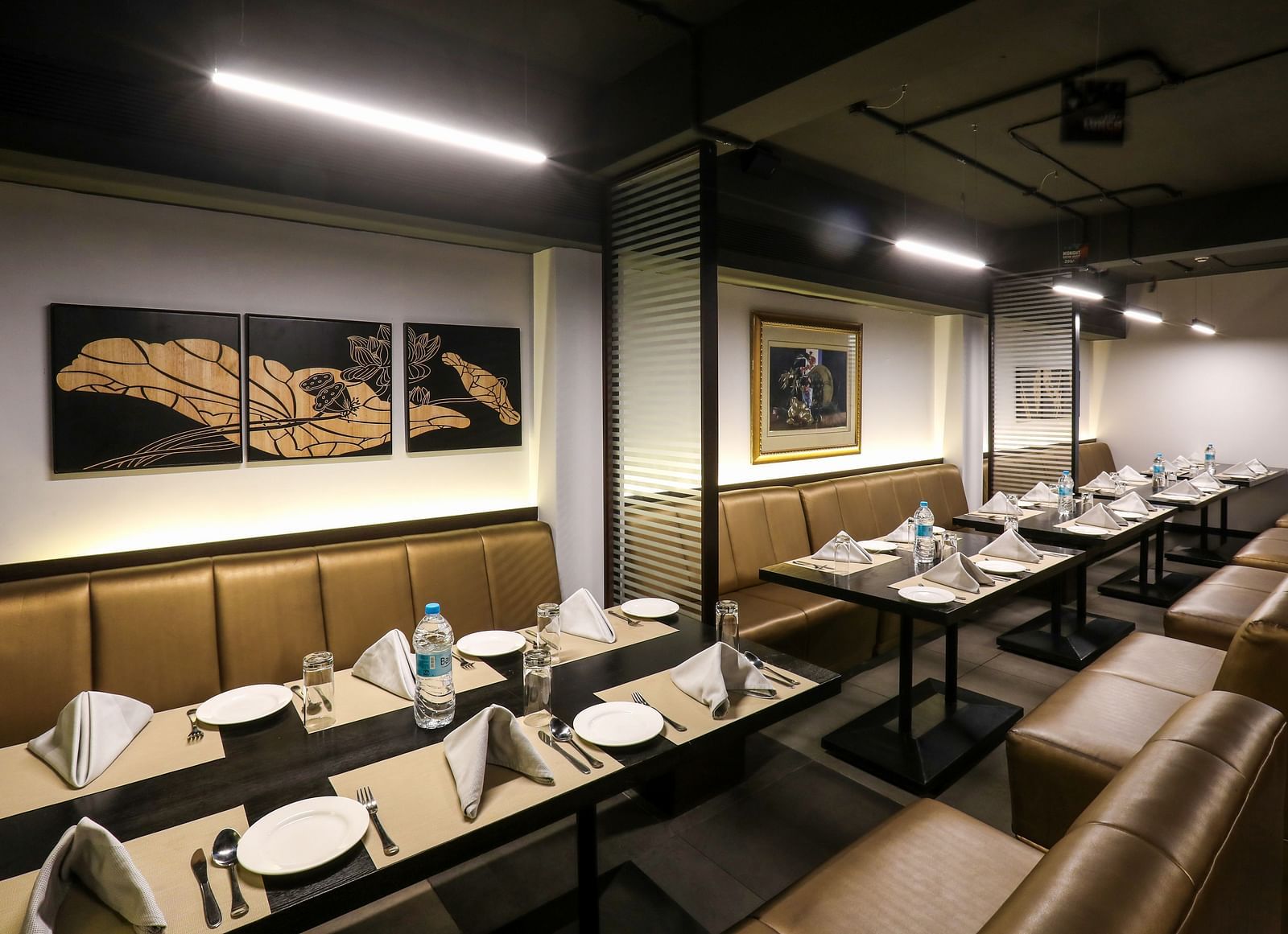 Tables and chairs placed in a line in a restaurant - Mango Hill Central, Chennai